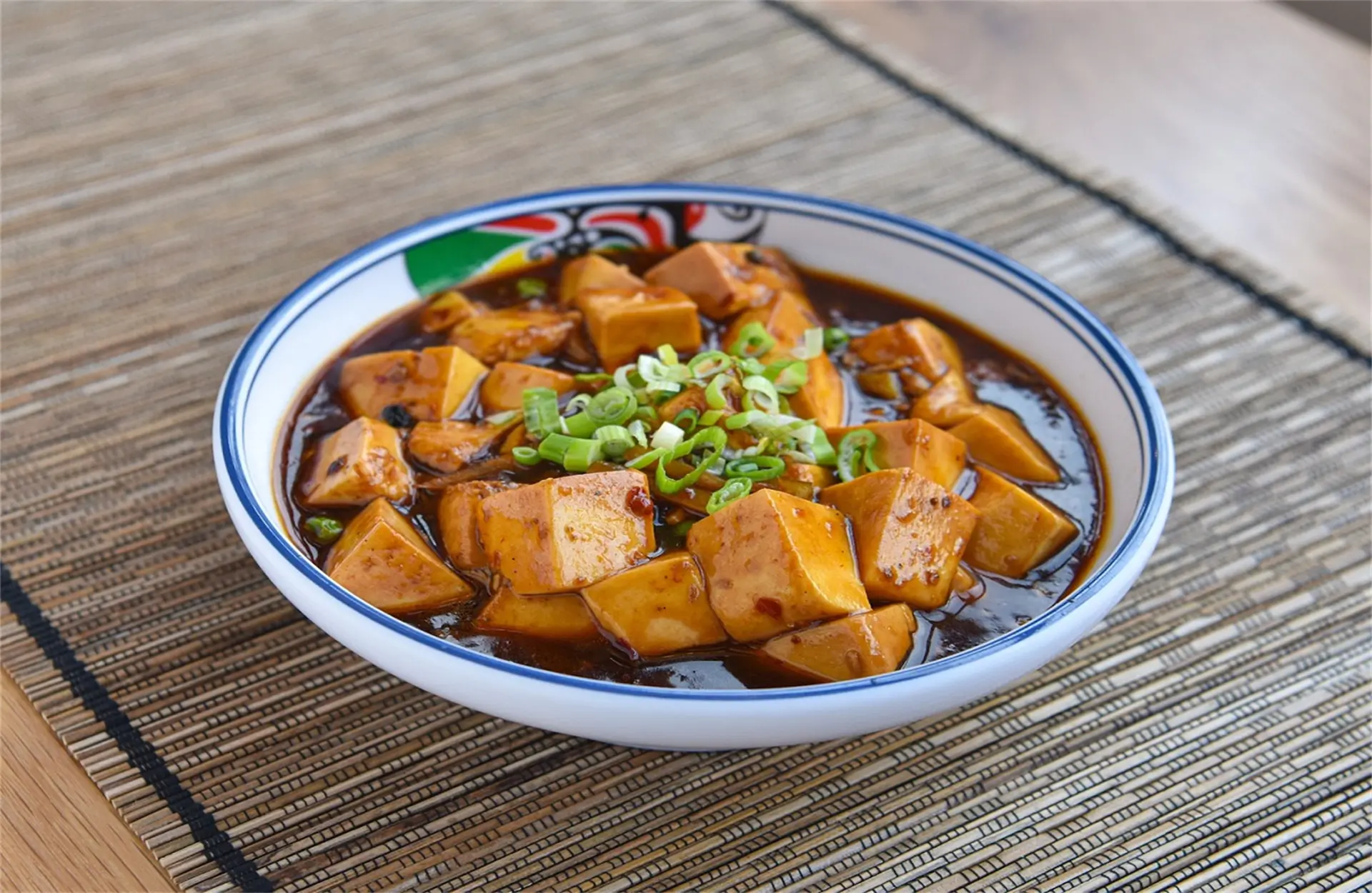 Wah-Wah-Kitchen-Inc-Chinese-Restaurant-Mapo-Tofu-Bowl-Amityville Mapo tofu in rich sauce, topped with green scallions at Wah Wah Kitchen Inc in Amityville.