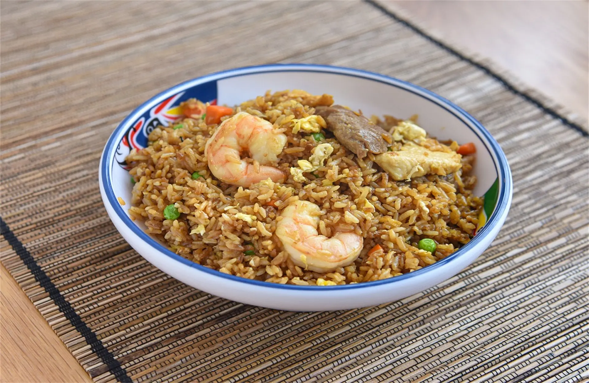 Wah-Wah-Kitchen-Inc-Chinese-Restaurant-Shrimp-Beef-Fried-Rice-Amityville Fried rice mixed with shrimp, beef, peas, and eggs at Wah Wah Kitchen Inc in Amityville.